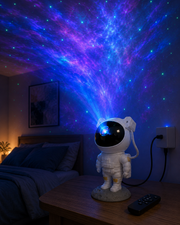 Astronaut galaxy projector connected and casting nebula stars in a bedroom