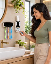 Woman using the wall-mounted Automatic Toothpaste Dispenser set in a modern bathroom