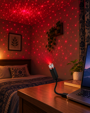 Flexible USB projection light connected to a laptop and projecting red dots
